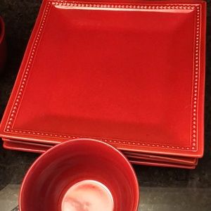 4 large red dinner plates with 8 matching bowls.